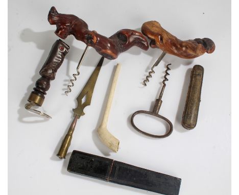 Two root wood handled corkscrews, together with a steel corkscrew, a clay pipe, trench art letter opener ,a cut throat razor,