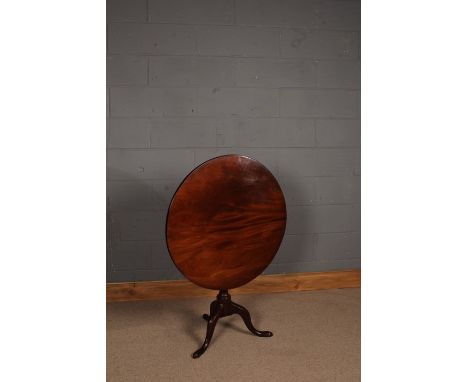 George III mahogany occasional table, the circular tilt top raised on turned column and tripod legs, 78cm diameter