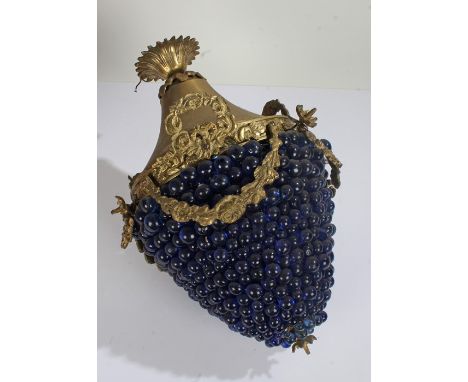 Brass and glass handing lamp with swag and bow garlands above blue glass grape effect shade, 44cm high 
