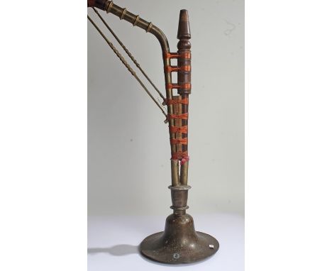 Eastern brass and hardwood floor standing hookah pipe, with brass mouthpiece and pipe, united with copper wire, circular bras