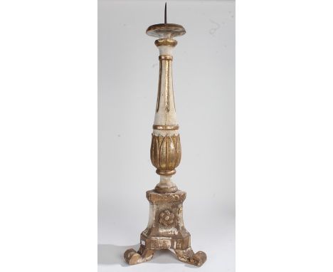 19th Century carved wooden floor standing pricket stick, painted in gilt and white, the metal spike on a circular platform wi