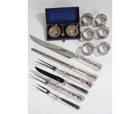 Pair of silver plated salts, each embossed with scrolls and gilded interiors, with a pair of silver salt spoons by Walker &am