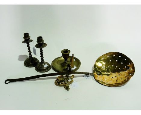 Two brass chamber candlesticks, another chamber candlestick, two plated candlesticks with floral decoration, two horse brasse