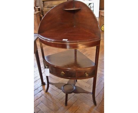 19th century mahogany corner washstand, having curved raised back with small shelf, single central and two dummy drawers to t