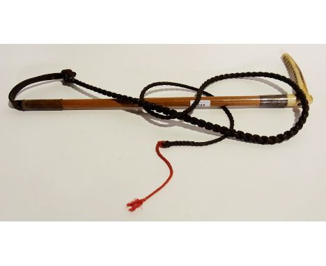 A hunting whip with bone handle and a carved grip with silver ring with the inscription "Major R I Tasker 201015 Tadworth, Lo