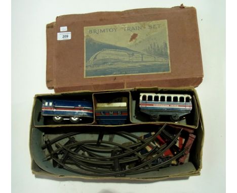 A Brimtoy tinplate clockwork train set with coronation LMS loco tender, coach and track together with lead model stationmaste