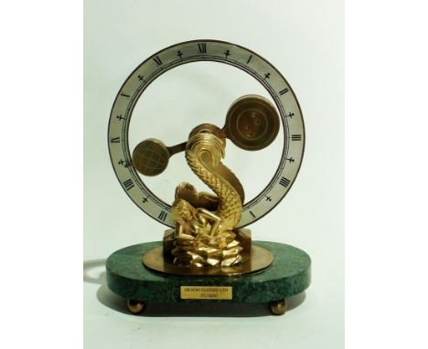 Devon Clock Limited mantel clock, gilt on marble stand with two mermaid supports, 31/1500