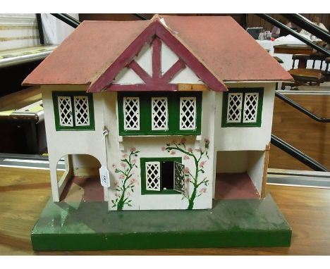 Mid 20th century breakfront doll's house, leaded light windows, together with a quantity of furniture and accessories (2 boxe
