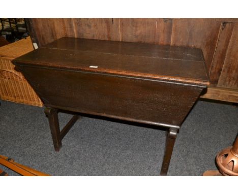 An 18th century oak tapered rectangular dough trough, planked top,  joined underframe, 70cm high, 101cm wide, c.1750