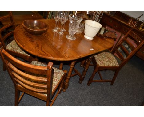 Kimberly Furniture Nottingham - a mid 20th century oak drop leaf dining table;  a set of four oak ladder back dining chairs