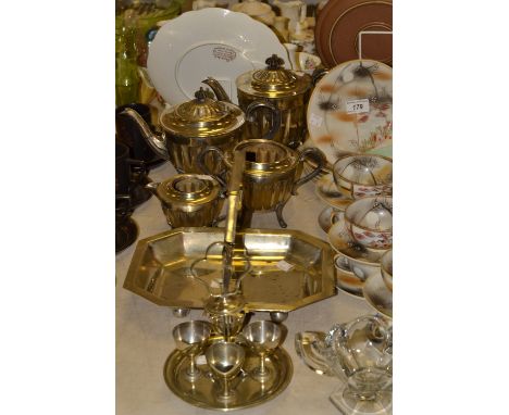 Silver plate - a four piece tea service, teapot, water jug, sugar bowl and milk jug;  a swing handle bowl;  an egg stand (6)