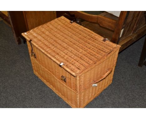 A large wicker hamper style laundry/storage basket 