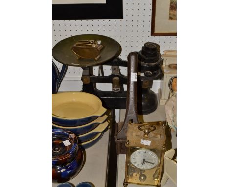 A set of early 20th century kitchen scales and weights;  a ricer;a German Kuma carriage clock 