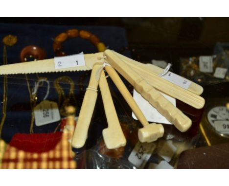 7 small 19th century novelty teething bars as a saw, knife , hammer, axe; etc 
