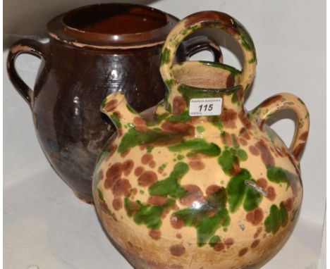 An early 20th century spouted ewer, mottle glazed in tones of green, brown and oatmeal, 37cm high; a two-handled jar (2)
