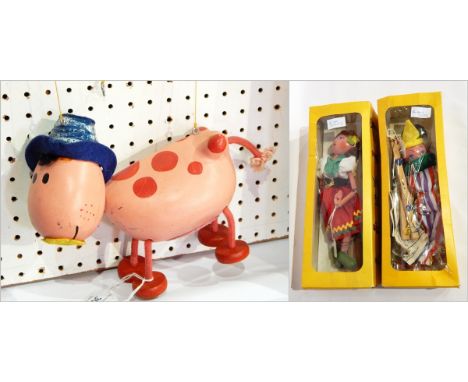 Two Pelham puppets, one of a girl with a red skirt, the other of a clown in a striped outfit, both boxed and another puppet o