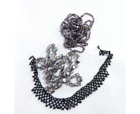 A three row cultured freshwater pearl necklace, another necklace with alternating faceted glass beads and a glass bead fringe