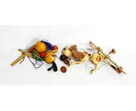 Pelham puppet brown and white spotty dog with brown ears and Pelham puppet emu-type bird with green bobble neck 