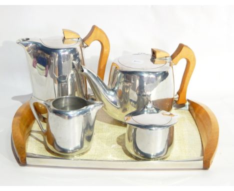 A picquotware teaset comprising formica and wooden tray, teapot, hot water jug, sugar and milk jug and a mahogany barometer w