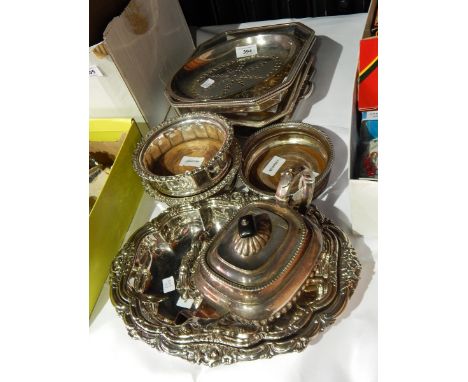 A quantity of silver plate include a pair of plated wine coasters, a teapot of half fluted form, vegetable dishes and covers,