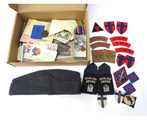 A collection of insignia and ephemera within a metal travelling trunk relating to A.A. NEWING and 1148897 C.E. NEWMAN includi