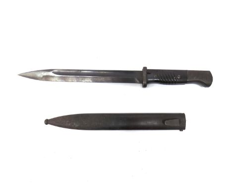 A WWII German Mauser bayonet with Bakelite grips, dated 41, together with steel scabbard dated 42 