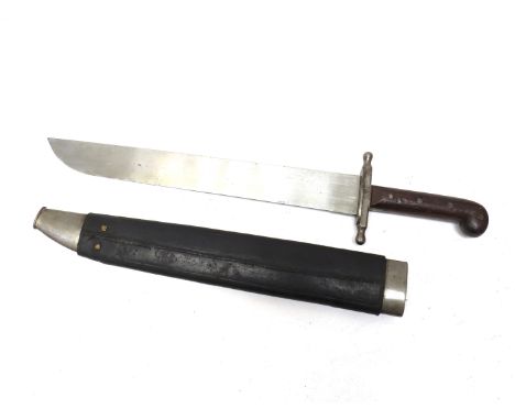 An 19th Century oversized machete with wooden grip, indistinct stamping to blade, steel and leather scabbard 