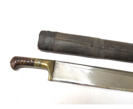 A 19th Century Khyber knife, the brass bound hilt with ribbed horn grip joining a tapering flat-back blade, with steel mounte