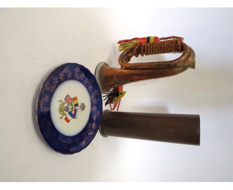 A WWI German shell case dated 1916, a copper and brass bugle with Royal Artillery badge and a WWI 'For Right and Freedom' pla