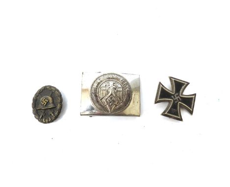 A Third Reich era German Hitler Youth belt buckle, a wound badge and an Iron Cross first class medal (3)