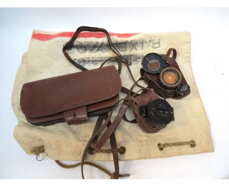 A quantity of WWI and later militaria including Sam Browne belts, compass, 1940 dispatch rider's case and a 1914 Field Servic