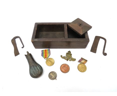 A tinder box together with contents including pocket pistol powder flask and medals including Victory medal 