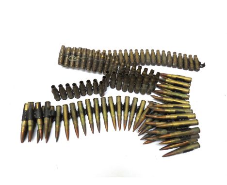 A quantity of inert brass ammunition, some linked 