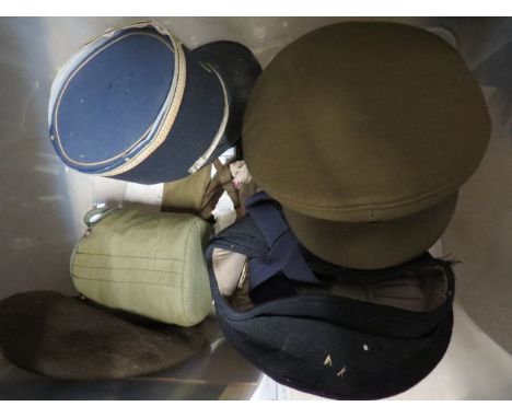 A box of headwear including 1960's Belgian army peaked hat, Royal Naval and others etc 