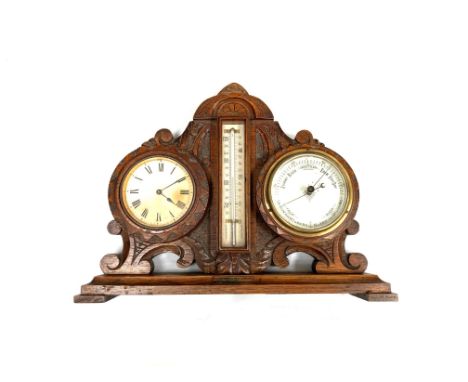 An early 20th Century desk barometer, thermometer and barometer with plaque "From the teak from the decks of HMS Iron Duke. A