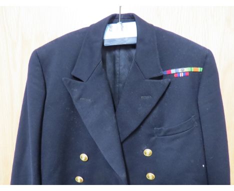 A 1940's Naval officer's peaked cap with King's crown badge, together with service dress jacket with WWII medal bars. Provena