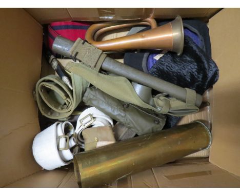 A box of mixed militaria including WWI shell case, copper bugle and belts etc 