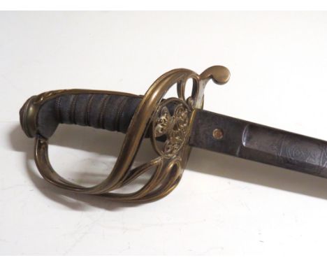 A Victorian 1822 Pattern infantry officers sword, the brass Gothic form hilt with scrolled quillon and folding guard set with