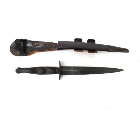 A Fairbairn Sykes (FS) Third Pattern type Commando dagger/knife, with brass mounted leather sheath