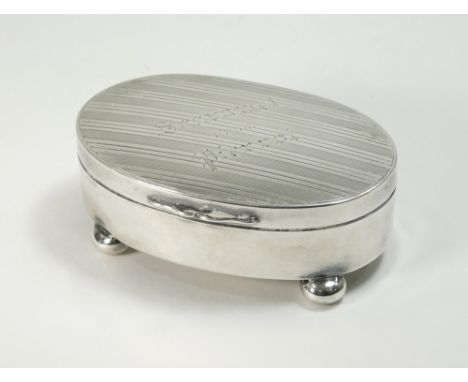 SILVER BOX. An oval engine turned silver box, the lid inscribed 'Scaramel from Pierrot'. Chester 1911. Retailer's mark for Ha