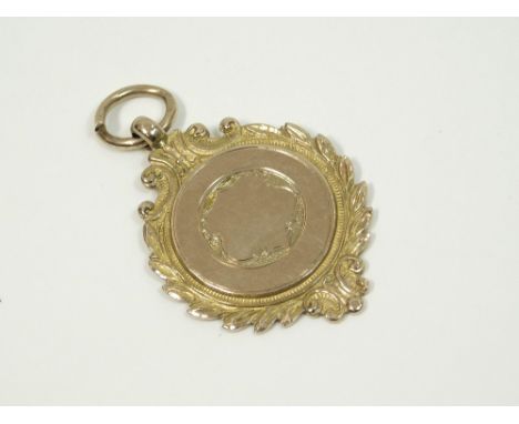 GOLD FOB. A 9ct. gold watch chain fob. Approx. 7.6g.  Please note that all items in this auction are previously owned & are o