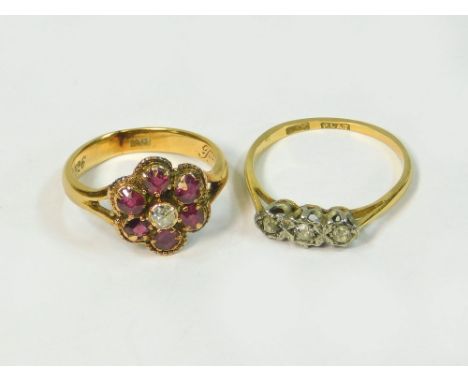 GOLD RINGS. An 18ct. gold ruby & diamond cluster ring, shank re-sized. The shank interior engraved Xmas 1926. Also an 18ct. g