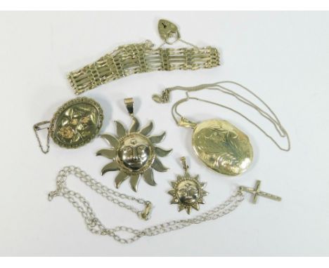 SILVER LOCKET ETC. A modern engraved silver locket on silver chain, length of locket incl. bale, 5.5cm. Also, two silver sun 