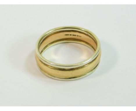 GOLD BAND. A 9ct. yellow & white gold band. Size R/S. Approx. 6.7g.  Please note that all items in this auction are previousl