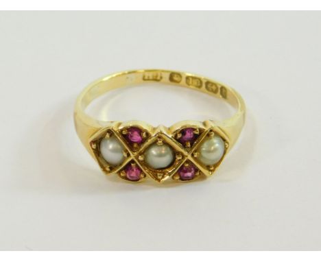 GOLD RING. An 18ct. gold Victorian ring, set with three half pearls & four rubies. (shank worn). Size R/S.  Please note that 