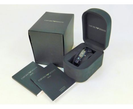 EMPORIO ARMANI. A lady's Emporio Armani wristwatch, the bezel & articulated strap of black riveted leather. Original box, doc