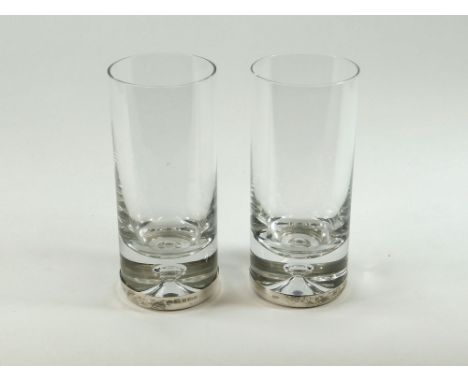 GLASS TUMBLERS. Two silver mounted, hand blown glass tumblers by Laurence R Watson & Co. Each silver mount with the maker's m