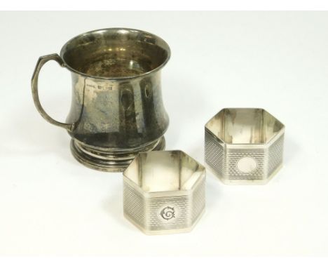 NAPKIN RINGS ETC. Two engine turned napkin rings & a silver Christening mug. Birmingham 1952. Approx. 125g. (4 t.oz.)Please n
