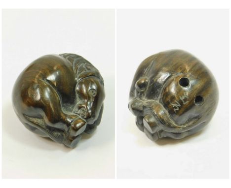 NETSUKE. A carved hardwood sleeping horse netsuke, signed. Approx. 3cm.  Please note that all items in this auction are previ