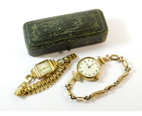 WRISTWATCHES. A lady's early 20th century, 9ct. gold cased wristwatch on later gold plated strap. Also a lady's 18ct. gold ca